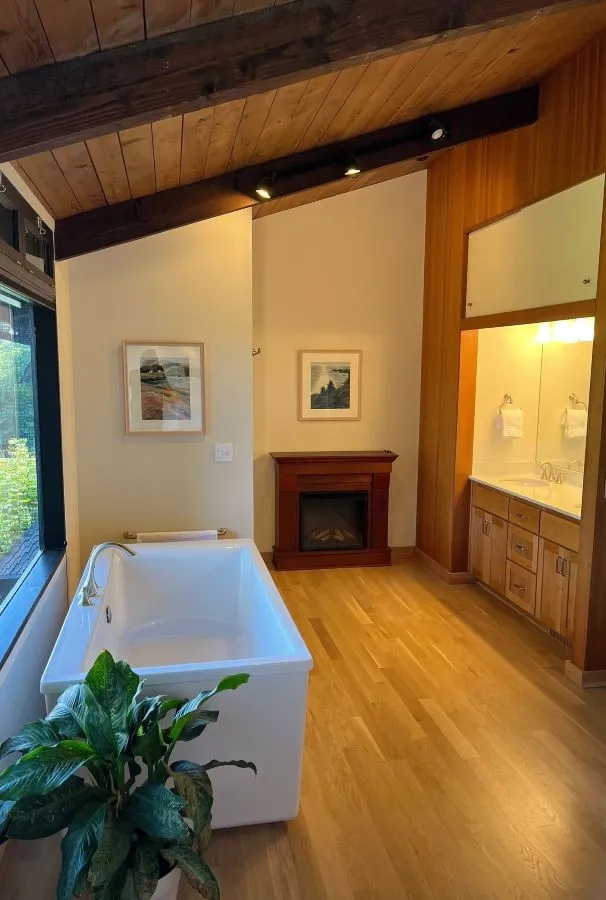 Bathroom remodel with freestanding tub and vaulted wood ceiling in a southwest hills Portland home
