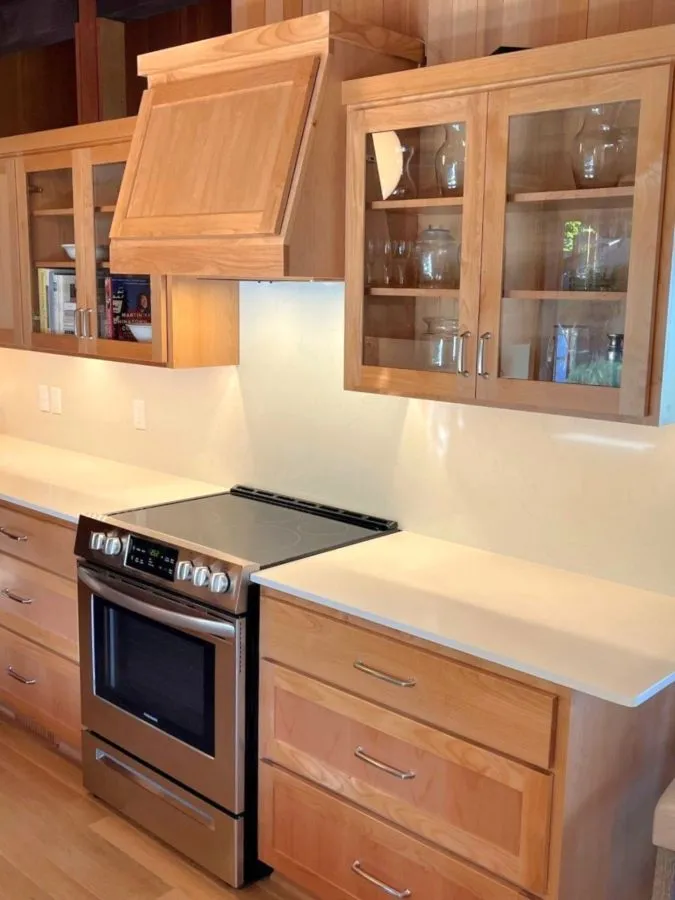 Kitchen remodel with custom wood cabinetry and built-in range area in a southwest hills Portland home